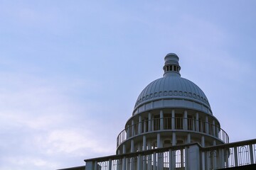 Fototapeta na wymiar White building dome on morning sky