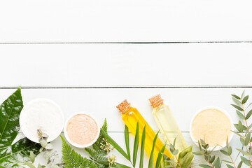 Beauty and aromatherapy concept with spa set on pastel rustic wooden background.