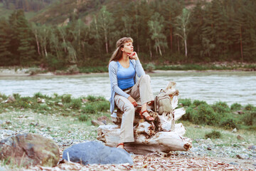 girl sitting by the river