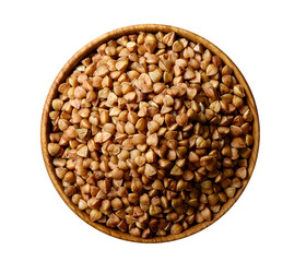 Dry food buckwheat grains in wooden bowl isolated on white.