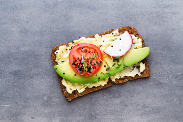 Sandwiches with cream cheese, vegetables and salami.