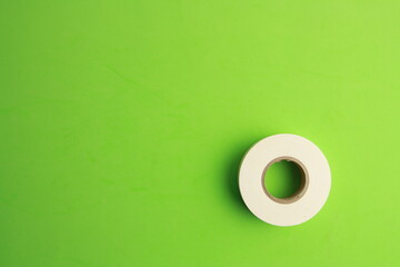 Fototapeta na wymiar roll of white plastic insulating tape