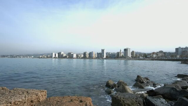 Pan right on the city of Sidon as seen from Sidon Sea Castle, Lebanon