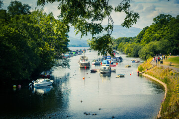 Scenic view of Balloch harbour near Loch Lomond with boats on river Leven in Scotland, UK.