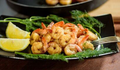 Shrimps on a plate with herbs
