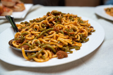 Pasta with tomato sauce served hot , a tasty traditional Italian dish food