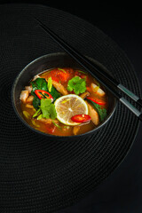 Traditional asian soup on black background