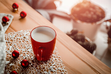 ot drink in cup on wooden table and blurred background of window. Free space for your decoration and small plants. Home interior and copy space. 