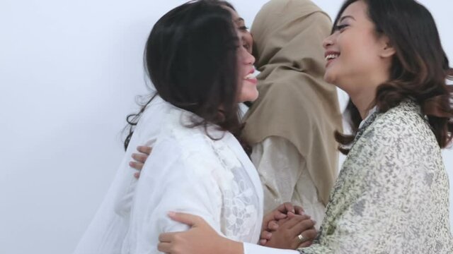 Portrait of a group of beautiful muslim female friend embracing