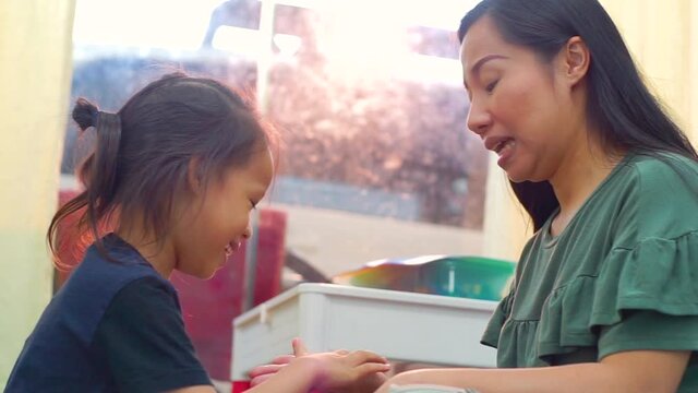 Happy loving family. Mother and her daughter child girl playing high five and hugging