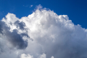 White and gray clouds in sunny sky. Сontrast bright background