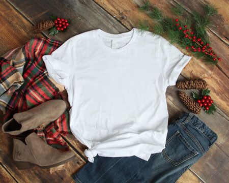 Flat lay mockup of white tshirt with Christmas accessories
