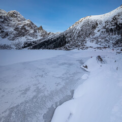 Fototapeta na wymiar Morskie Oko in winter sunrise in Tatra Mountains in Poland