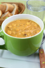 bowl of soup with vegetables and croutons