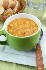 bowl of soup with vegetables and croutons