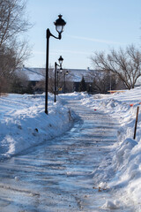 road with snow and street lights. Snow removal route in winter