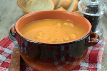 bowl of soup with vegetables and croutons
