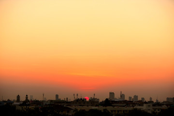 Sunset view Beautiful golden yellow sky in big cities	