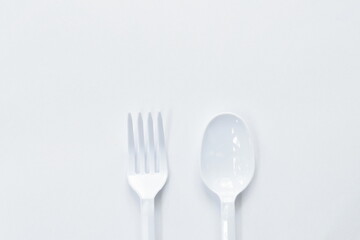 plastic spoon and fork for single used on white background