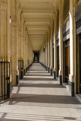 Column corridor in Palais Royal, Paris. France. 