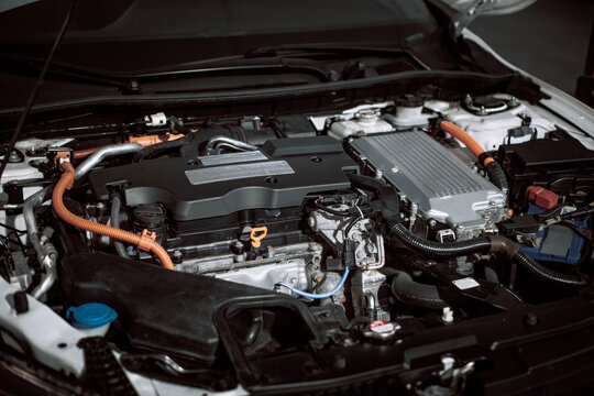 Car gasoline engine. Car engine part. Close-up image of an engine. Engine detailing in a new car