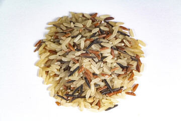 Heap of mix raw white, red and brown rices