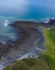 Zumaia flysch geological strata layers drone aerial view, Basque Country
