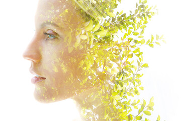 Double exposure of a healthy natural beauty's profile combined with bright green vibrant tropical...
