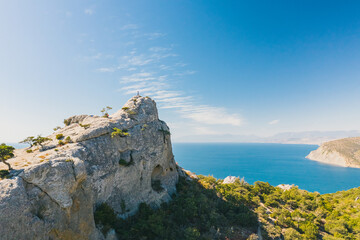 Fototapeta na wymiar Rock overlooking the sea and the bay. Tourist place in Crimea with a beautiful view of the sea