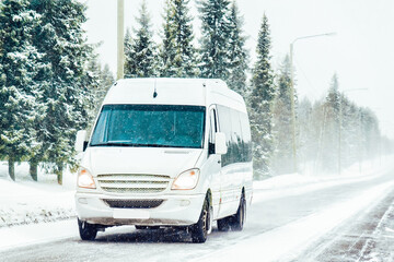 Minivan and cars in road in winter Rovaniemi