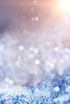 Empty snowy scene. Abstract winter background bokeh effect. Frost, snowflakes. Sunlight in the winter. Blurred background.