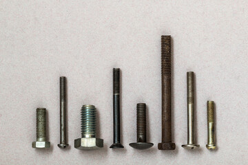 Close-up shot of bolts of different sizes, colors and shapes