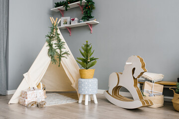 Children's room with toys, wigwam, horse. christmas decor © Sunshine