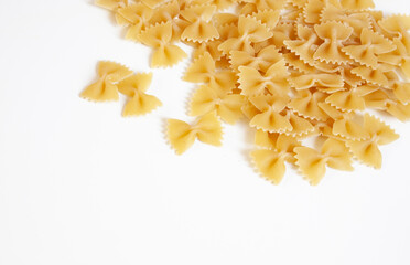 Italian food. Pasta in the form of bows on a white background. Pasta farfalle