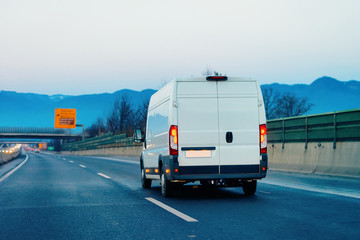 White Minivan at road