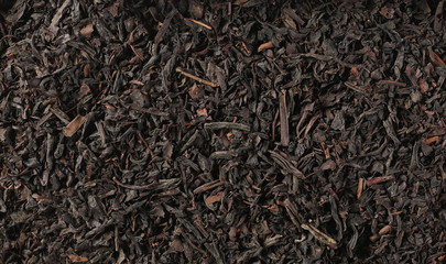  Dry black tea leaves background and texture