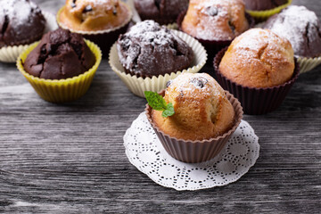 Handmade muffins close up on a black wooden table