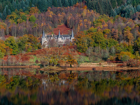 Autumn reflections on Loch Achray in Trossachs National Park