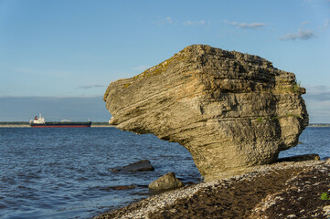 Stone wall on the Baltic sea in the summer. Pakri coast, island in Estonia, Europe.