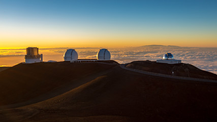Fototapeta na wymiar View on astronomic telescopes on Mauna Kea summit at sunset, Big Island, Hawaii