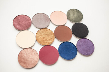 beauty concept. twelve different shades of shadow in round shapes on a white background