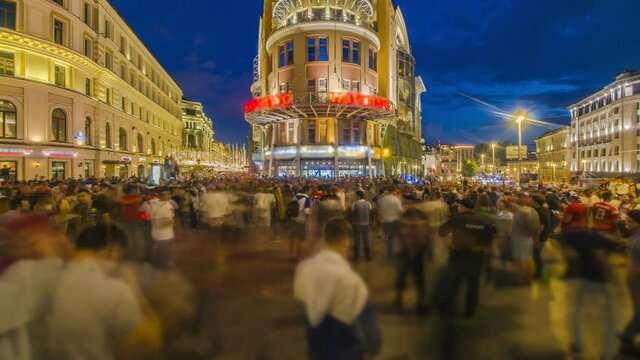 football fans and spectators have fun on the streets after the game,time lapse