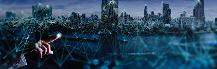 Woman hand touching Wireless network and Connection technology elements covering on Abstract building city.