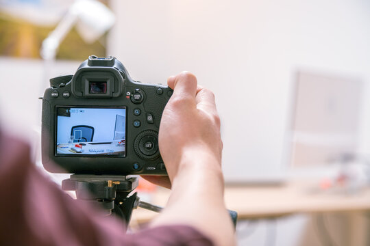 Filming With A Digital Camera: Man Is Using A Camera Standing On A Tripod