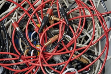 Tangled audio cables in a pile