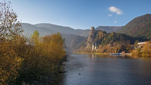 Hyper lapse of abandoned clifftop Strecno castle on Vag river at clear autumn morning, Slovakia.