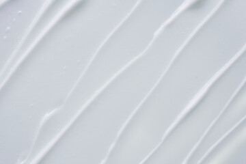 Obraz premium White texture and smear of face cream or white acrylic paint isolated on white background