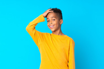 African American boy over isolated blue background has realized something and intending the solution