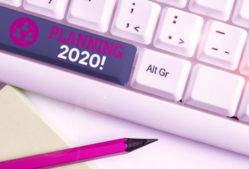 Conceptual hand writing showing Planning 2020. Concept meaning process of making plans for...