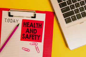 Conceptual hand writing showing Health And Safety question. Concept meaning regulations and procedures intended to prevent accident Metallic laptop clipboard paper sheet pencil colored background
